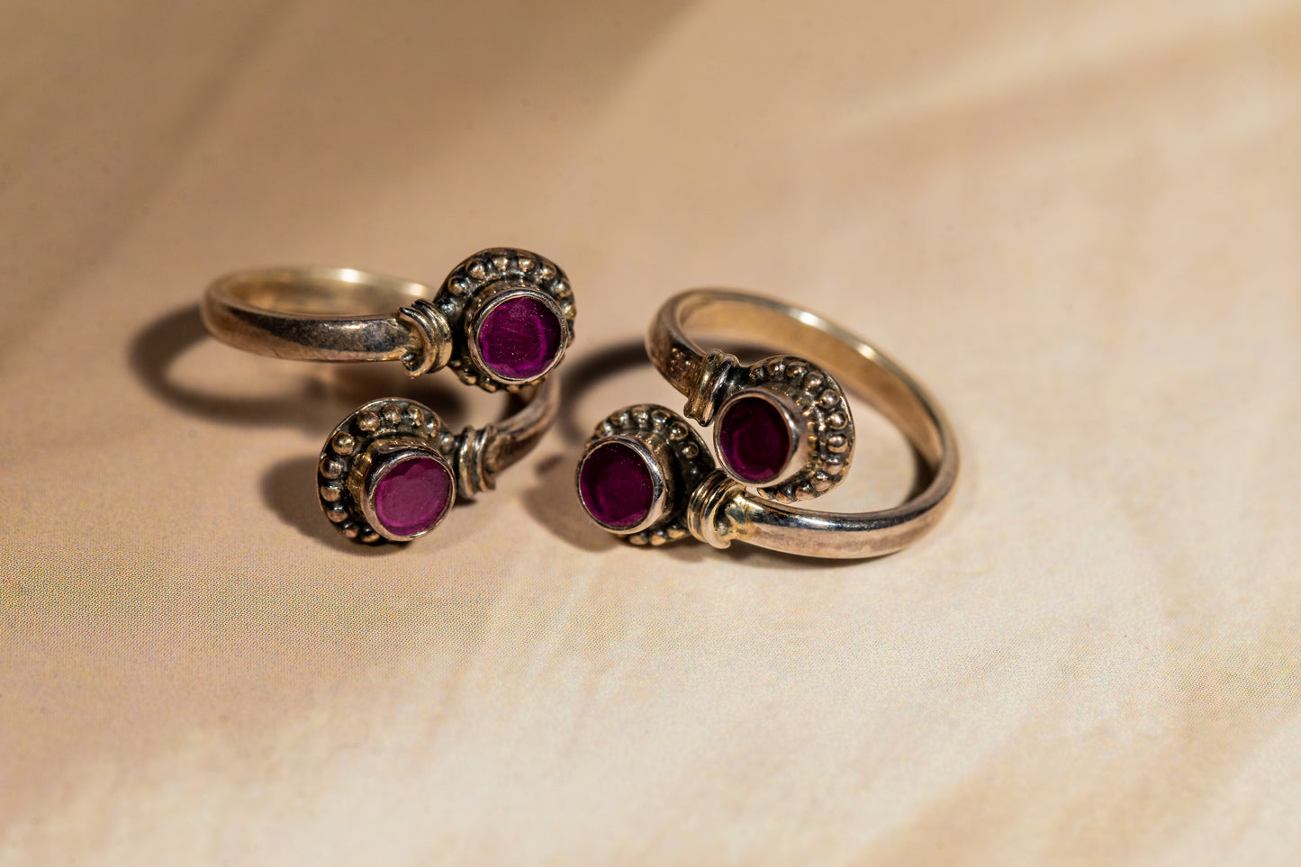 Handcrafted oxidised silver toe rings with magenta gemstones