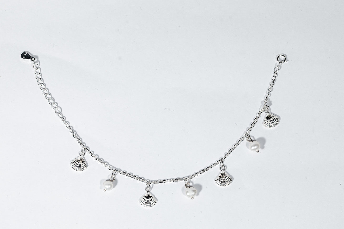 Sterling silver bracelet with freshwater pearls and shell charms