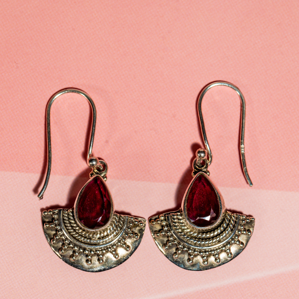 Handmade sterling silver dangle earrings with a red stone