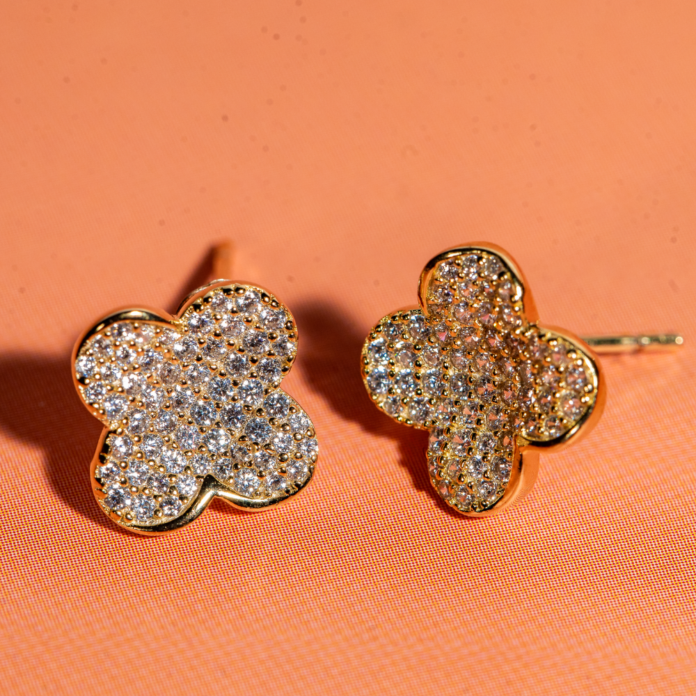 Gold toned clover shaped studs embellished with cubic zirconia