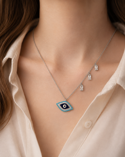 Sterling silver evil eye pendant necklace featuring a central eye motif with turquoise and cubic zirconia accents