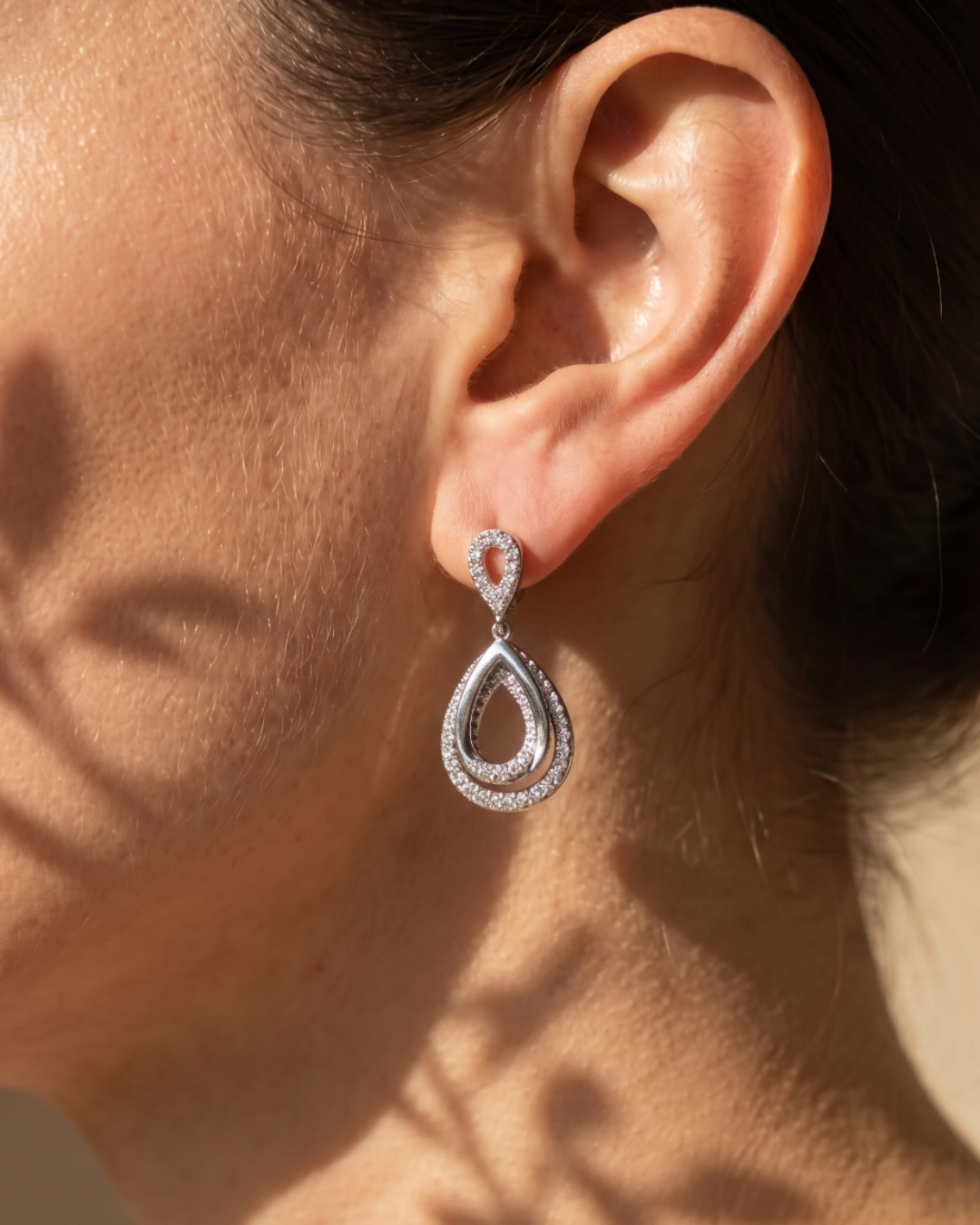 Rhodium finish drop earrings embellished with cubic zirconia