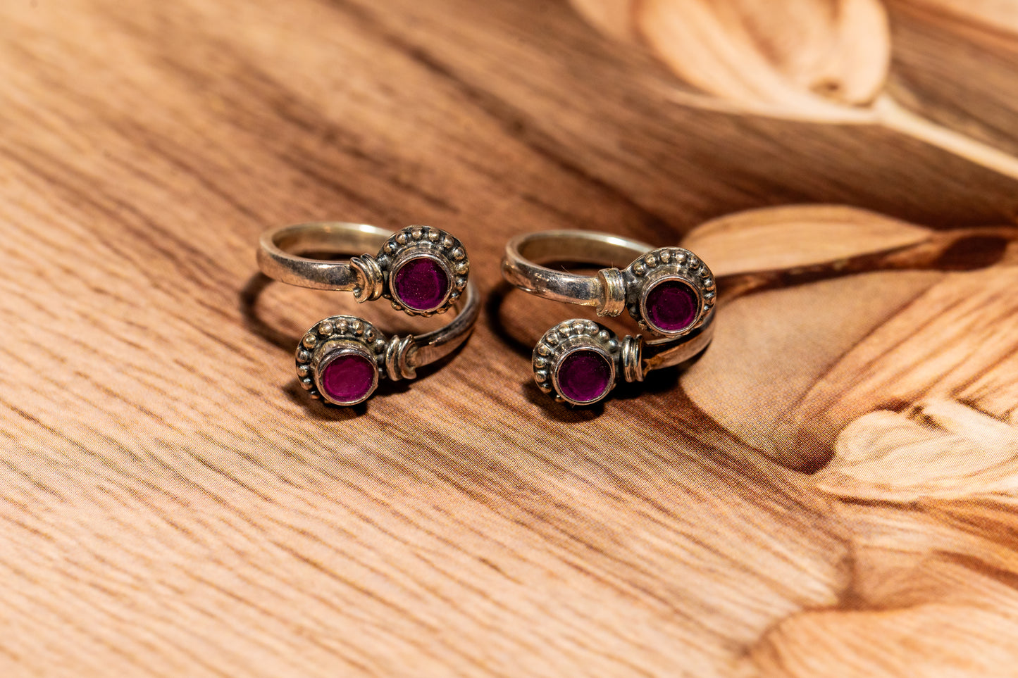 Handcrafted oxidised silver toe rings with magenta gemstones