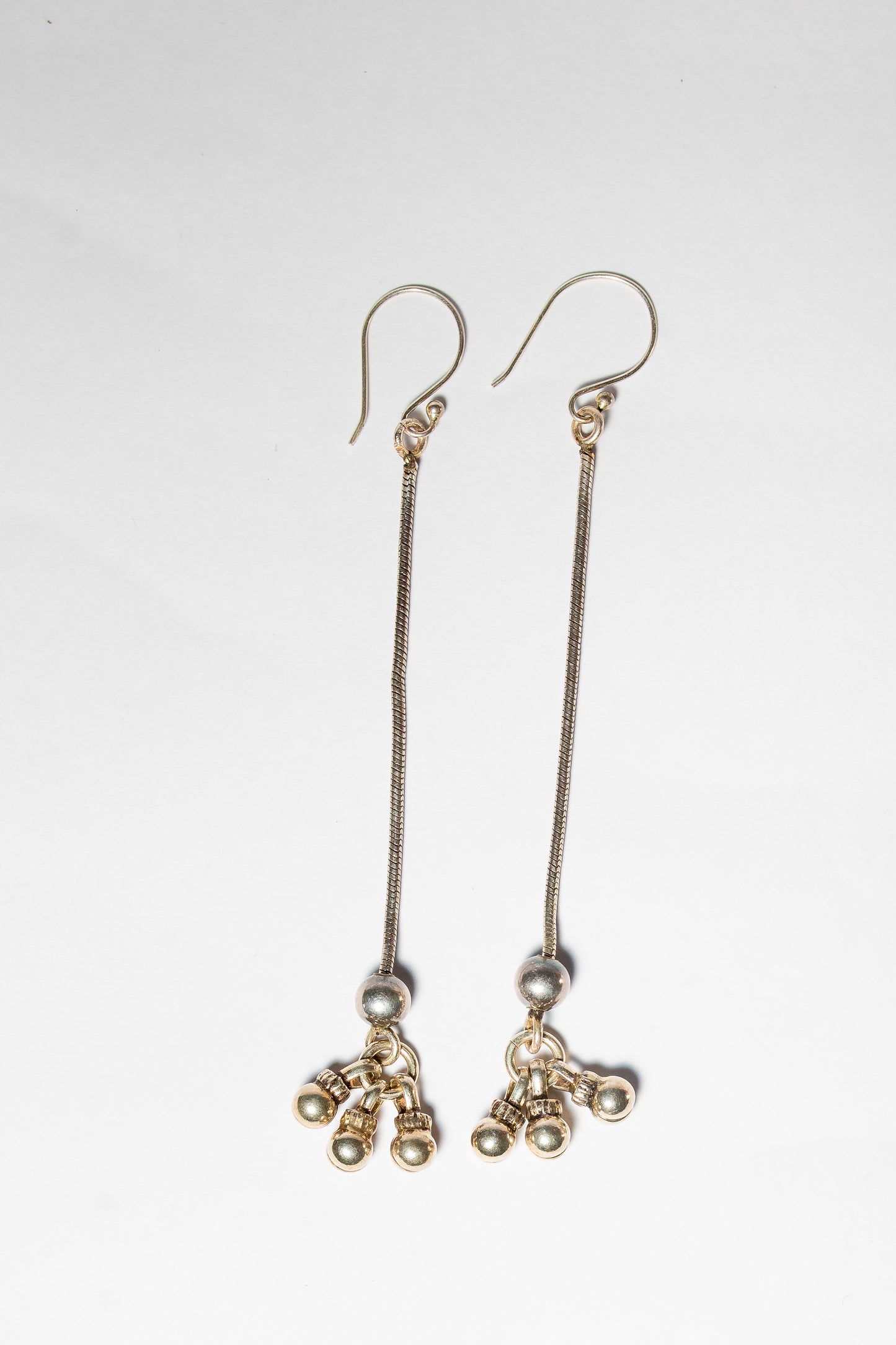 Long dangle drop earrings with small beaded accents