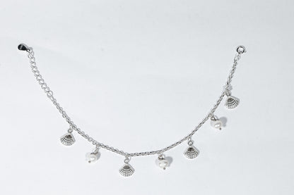 Sterling silver bracelet with freshwater pearls and shell charms