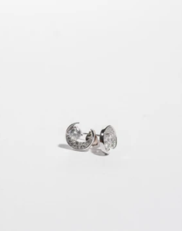 Silver toned crescent moon studs featuring cubic zirconia stones