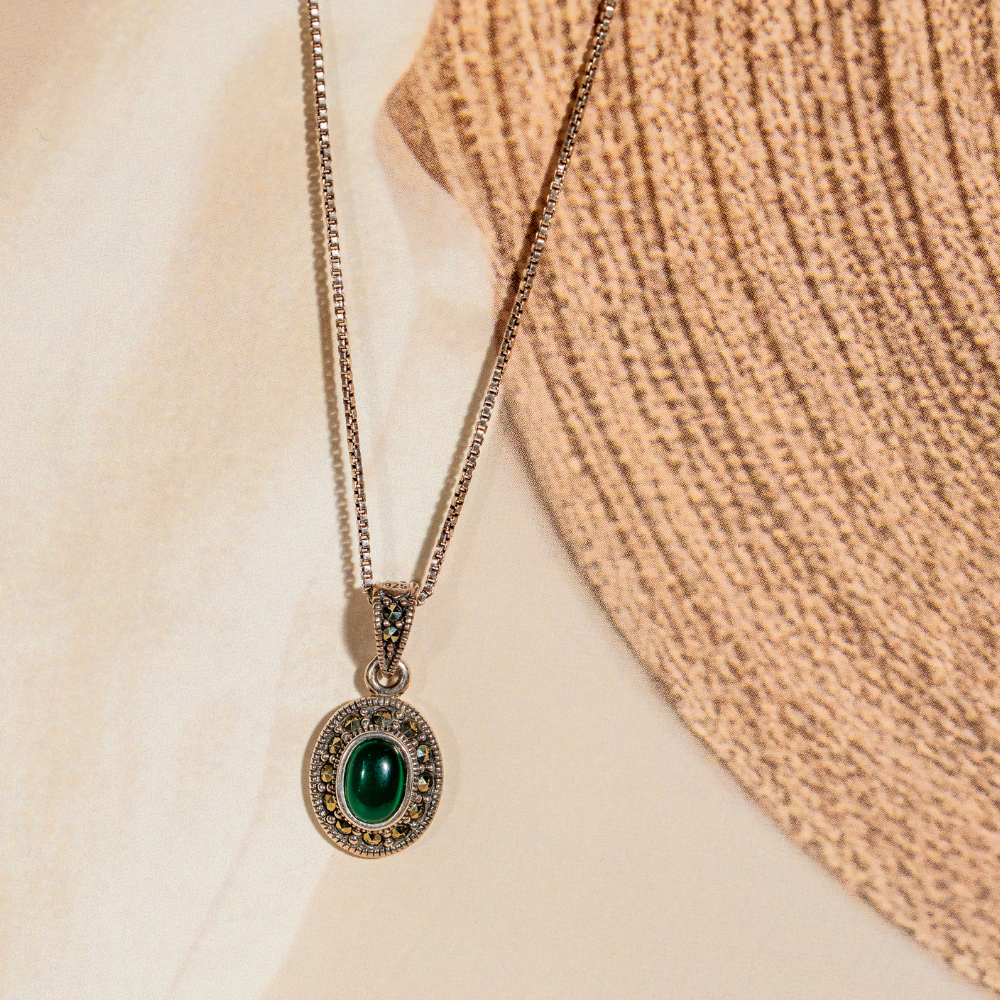 Sterling silver pendant necklace with green stone and marcasite stones