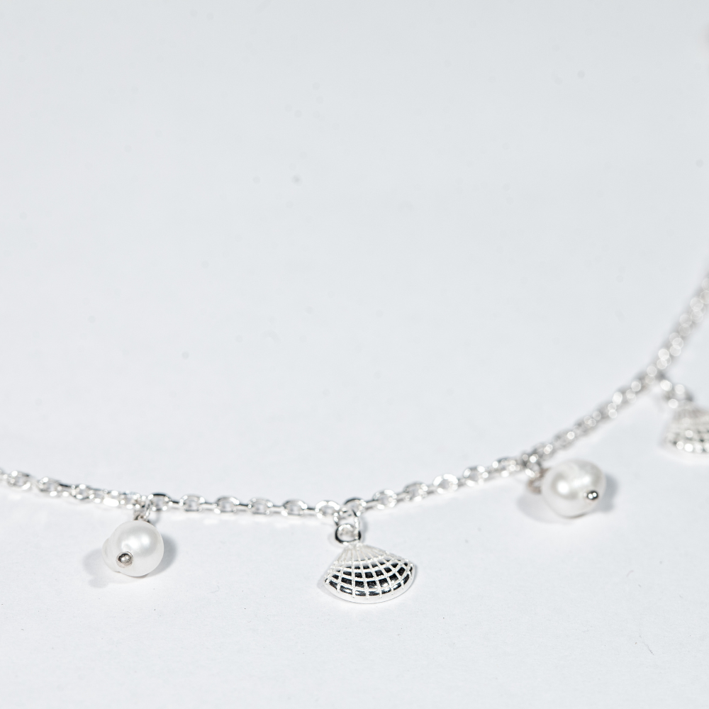 Sterling silver bracelet with freshwater pearls and shell charms