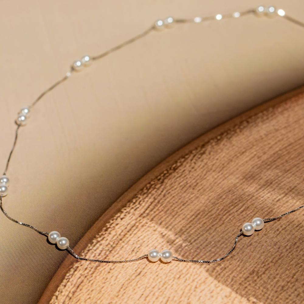 Silver chain featuring fresh water pearls