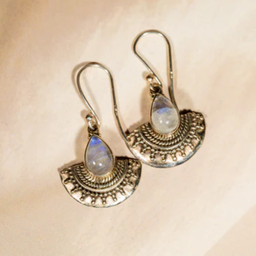 Handmade silver dangle earrings with a white stone